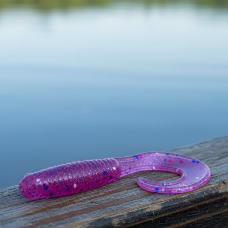 purple fishing lure on dark background